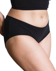 Side view of PROCLAIM black organic cotton mid-rise brief underwear