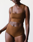high rise ella nude, a rich brown tone,  briefs in tencel, front view on model. 